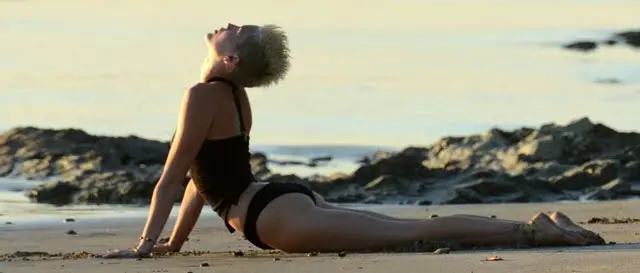 miley cyrus doing yoga in bikini at the beach